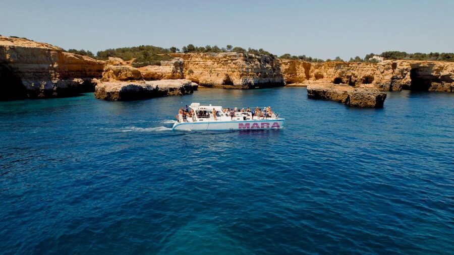 Albufeira: Caves and Coastline Catamaran Cruise to Benagil - The swim stop: how the captain chooses the moment