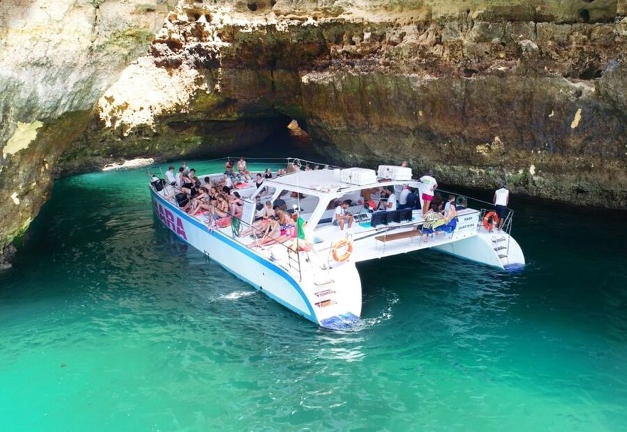 Albufeira: Caves and Coastline Catamaran Cruise to Benagil - Chapel Nossa Senhora da Rocha and Albandeira: religious landmark and a natural arch