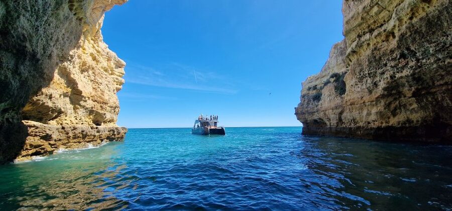 Albufeira: Coastline and Benagil Caves Tour by Catamaran - Guide style: multilingual storytelling you can actually follow