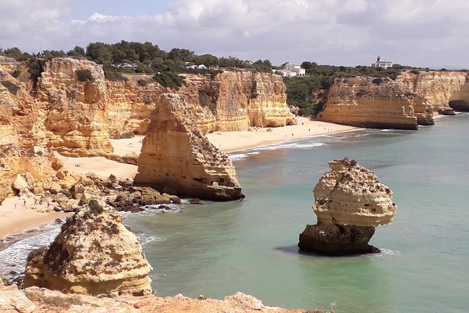 Discover The Algarve Region and The Local Gastronomy - Praia da Rocha: huge sand, Santa Catarina Fortress, and that classic beach energy