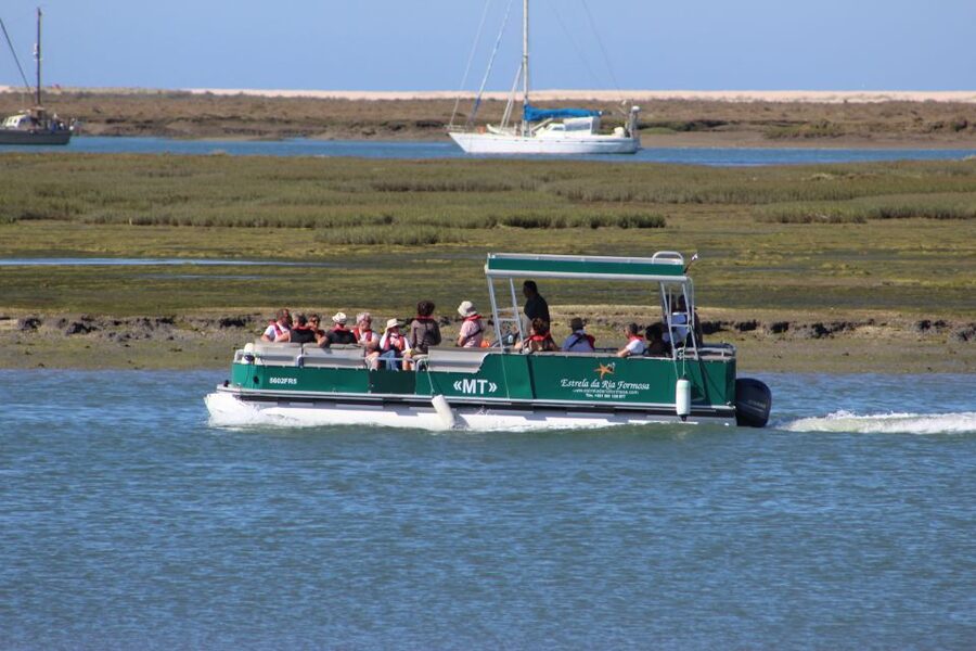 From Faro: 2-Island, 2-Stop Ria Formosa Catamaran Tour - Stop 1: Ilha Deserta, 45 minutes of beach, swim, and tide rhythm