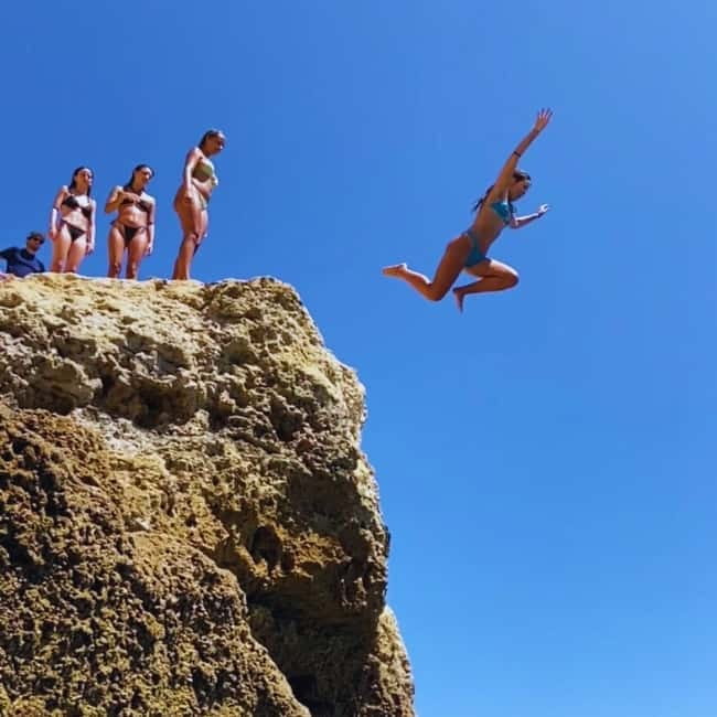 From Faro: Adventure Express Tour - Cliff Jump & Beach - Praia da Marinha: the beach break that feels like the reward
