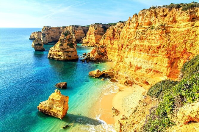 From Faro: Benagil Cave, Marinha & Carvoeiro Full-Day Tour - Praia da Marinha: cliff trails and the heart-shaped rock moment