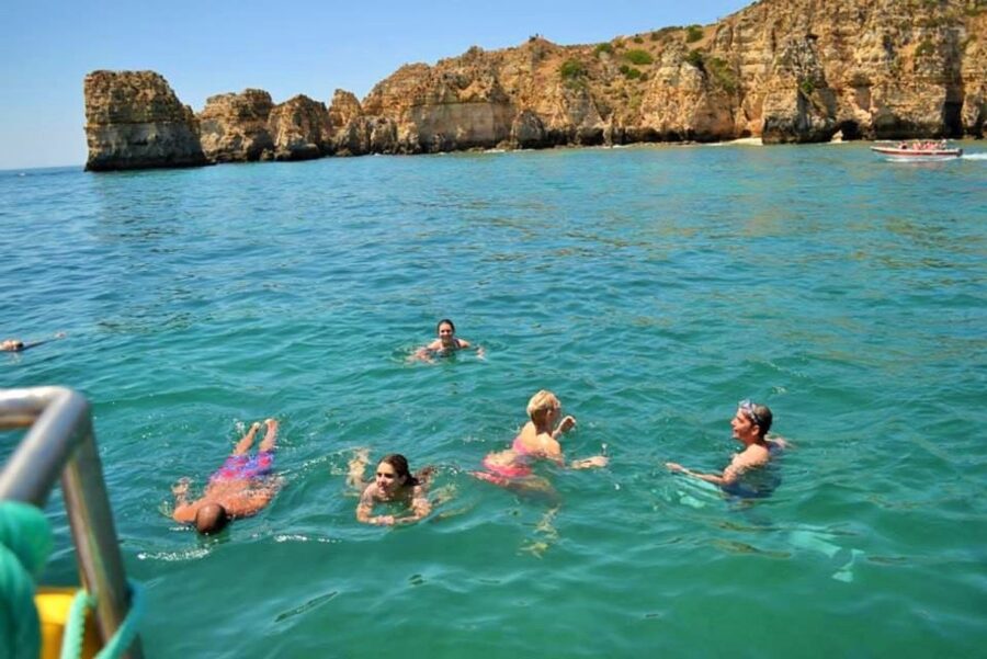 From Lagos: 2.5-Hour Guided Coastal Boat Tour & Grotto Visit - Caves visit by smaller boat: what you gain in the tight spaces