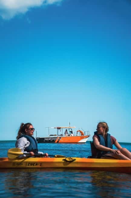 From Lagos: Ponta da Piedade Caves Kayak Tour from Catamaran - The slide-into-kayak moment and the guided grottos route