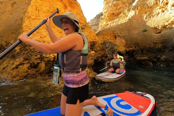 Guided SUP Caves Tour in Lagos – Ponta da Piedade | Small Group - Paddling the Ponta da Piedade cliffs, caves, and rock formations