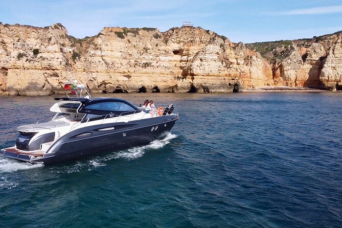 Half Day Private Charter morning /afternoon Yacht in Lagos - Dona Ana Beach: cliffs, golden strata, and turquoise water