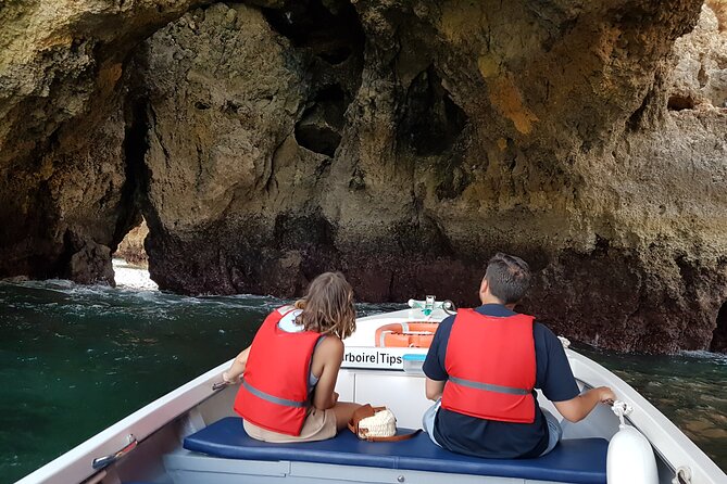 Ponta da Piedade Coastal Tour in Lagos, Algarve - Praia do Camilo: A Wooden Staircase and a Shell-Filled Rock Tunnel