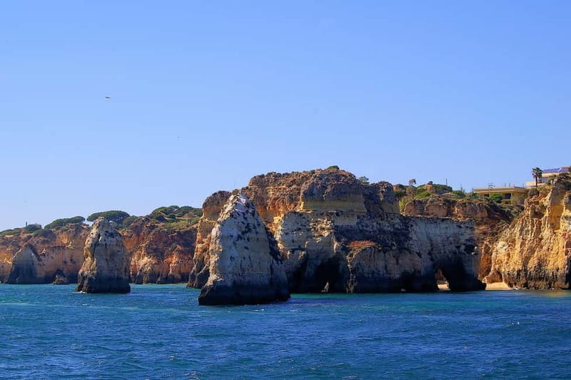Portimão: Boat Trip by Sailing Boat to Lagos Cape Caves - Reaching the Cape of Lagos and the Plank Moment
